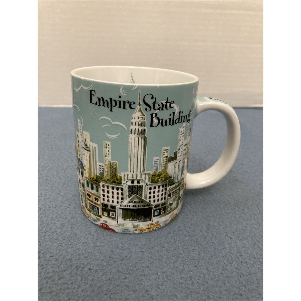 Empire State Building Coffee Mug featuring A Colorful NYC scene by Heidi Dobrott